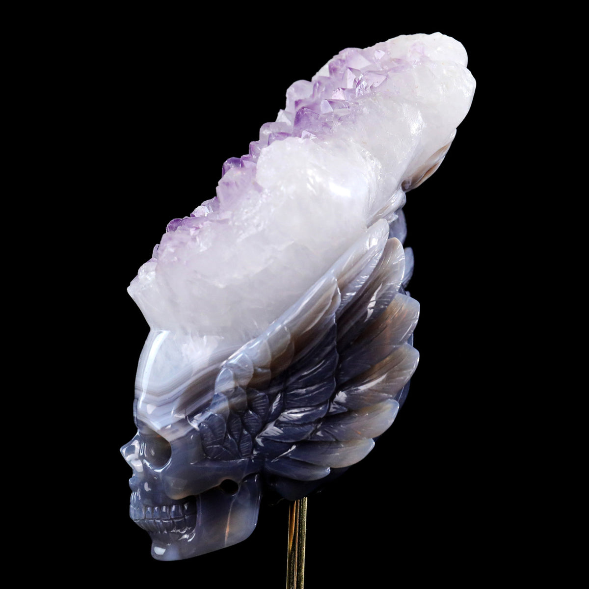Left view of a one-of-a-kind Amethyst winged geode skull carving