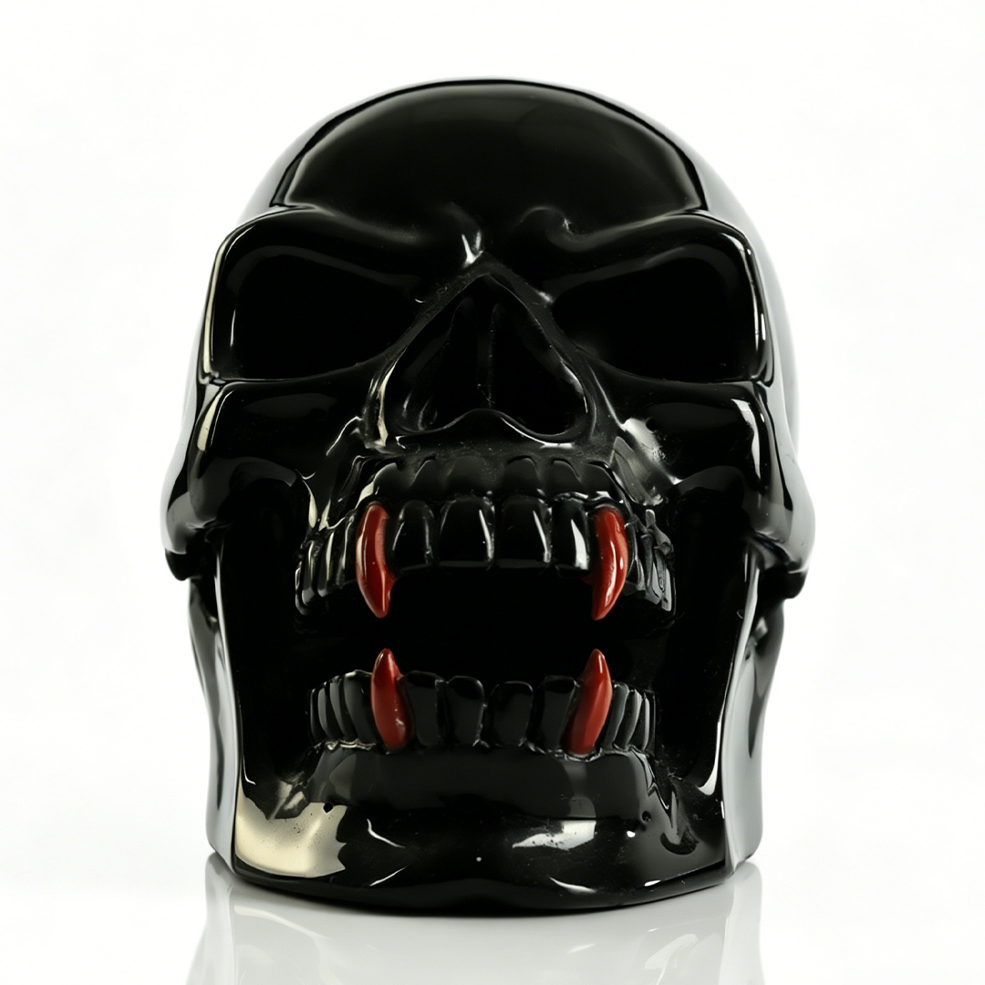 Additional view of a one-of-a-kind Black Obsidian and Red Jasper fanged skull carving