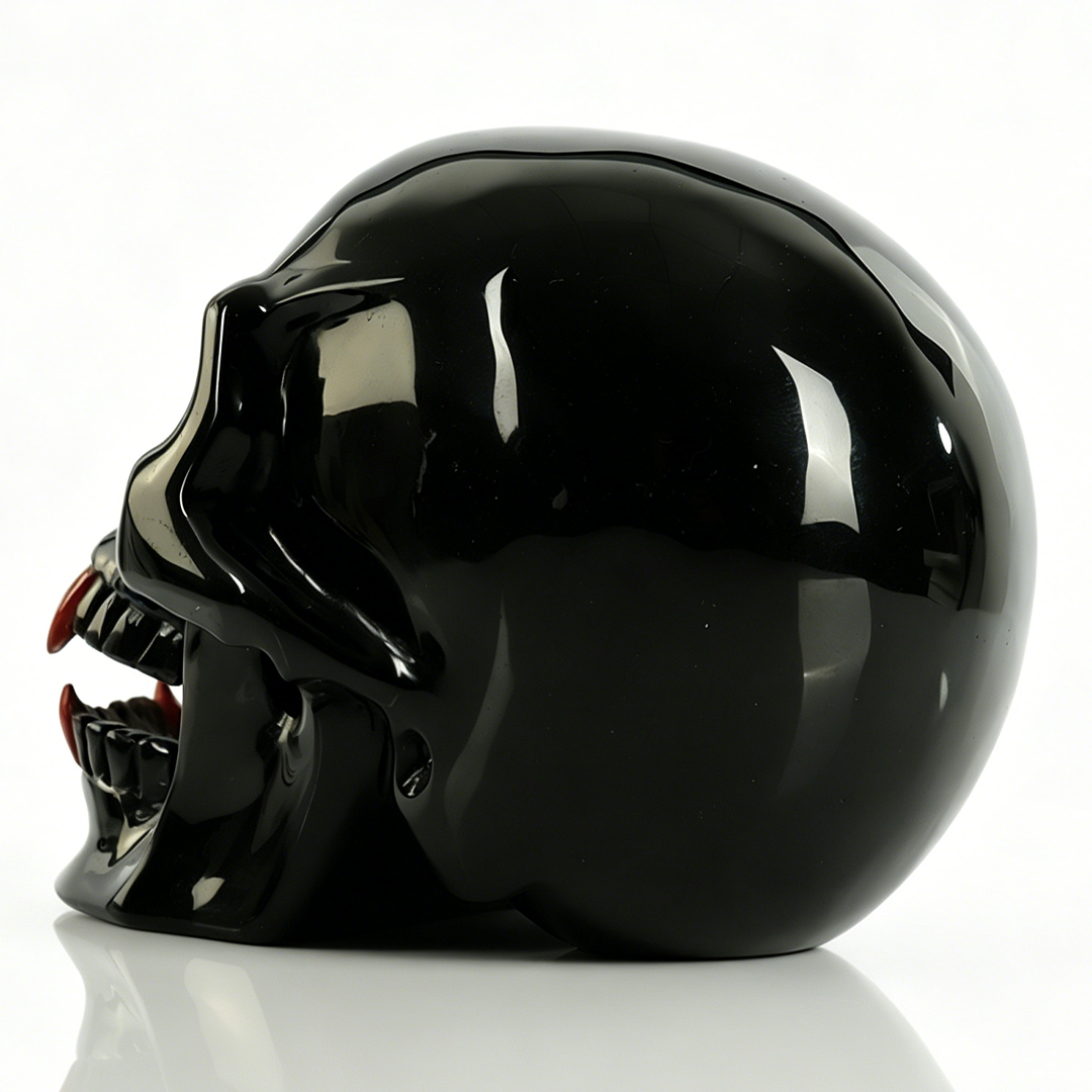 Additional view of a one-of-a-kind Black Obsidian and Red Jasper fanged skull carving