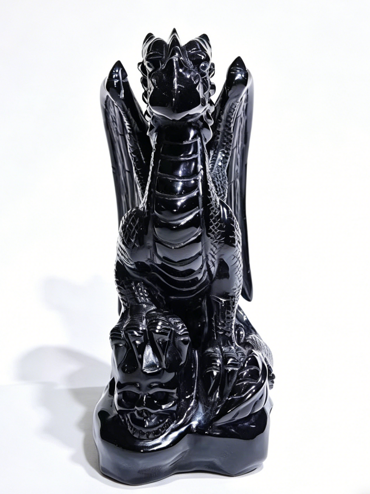 Additional view of a one-of-a-kind Black Obsidian skull and winged dragon sculpture