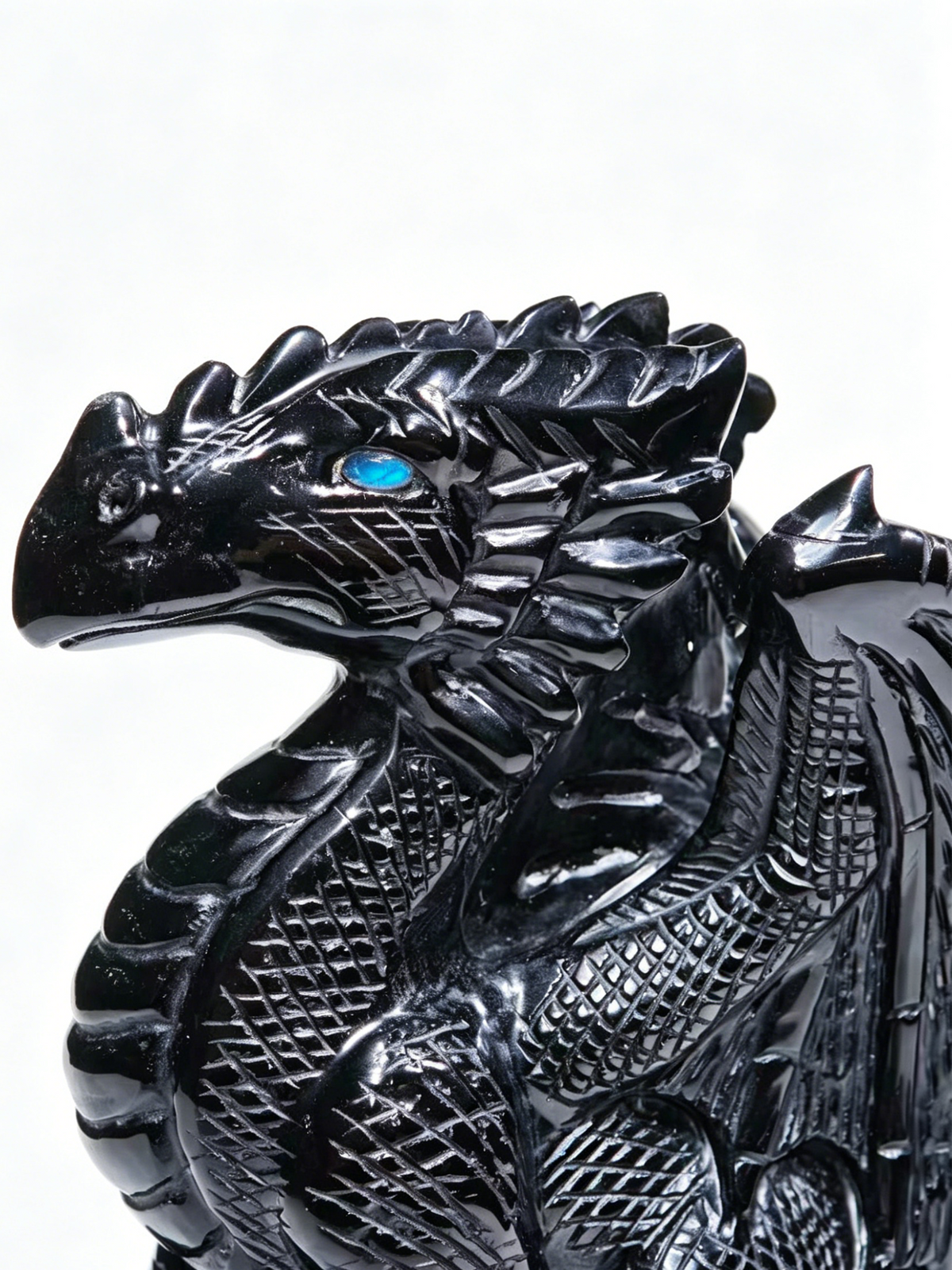 Additional view of a one-of-a-kind Black Obsidian skull and winged dragon sculpture