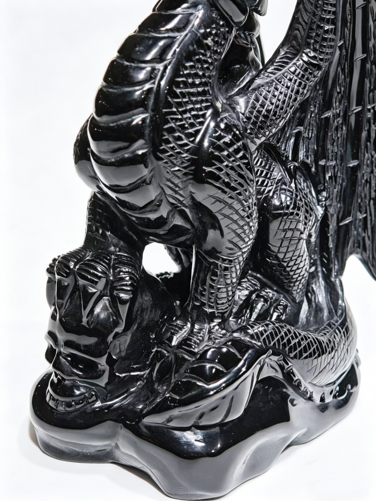 Additional view of a one-of-a-kind Black Obsidian skull and winged dragon sculpture