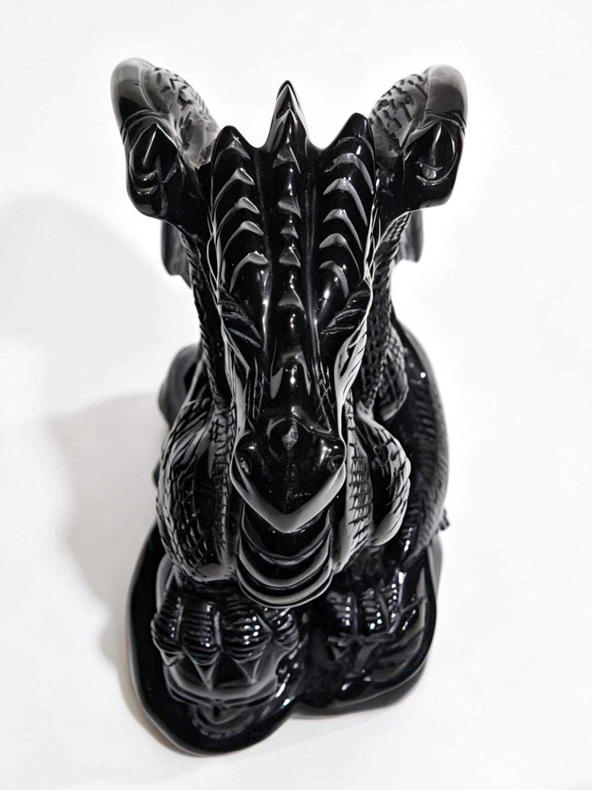 Additional view of a one-of-a-kind Black Obsidian skull and winged dragon sculpture