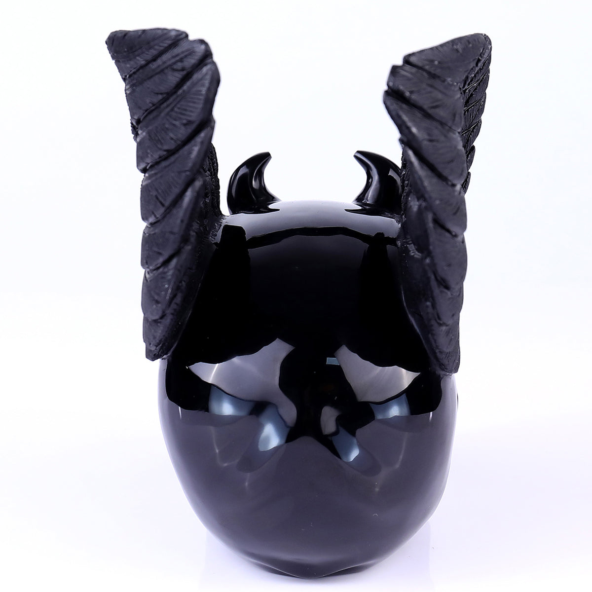 Back view of a one-of-a-kind Black Obsidian winged skull carving
