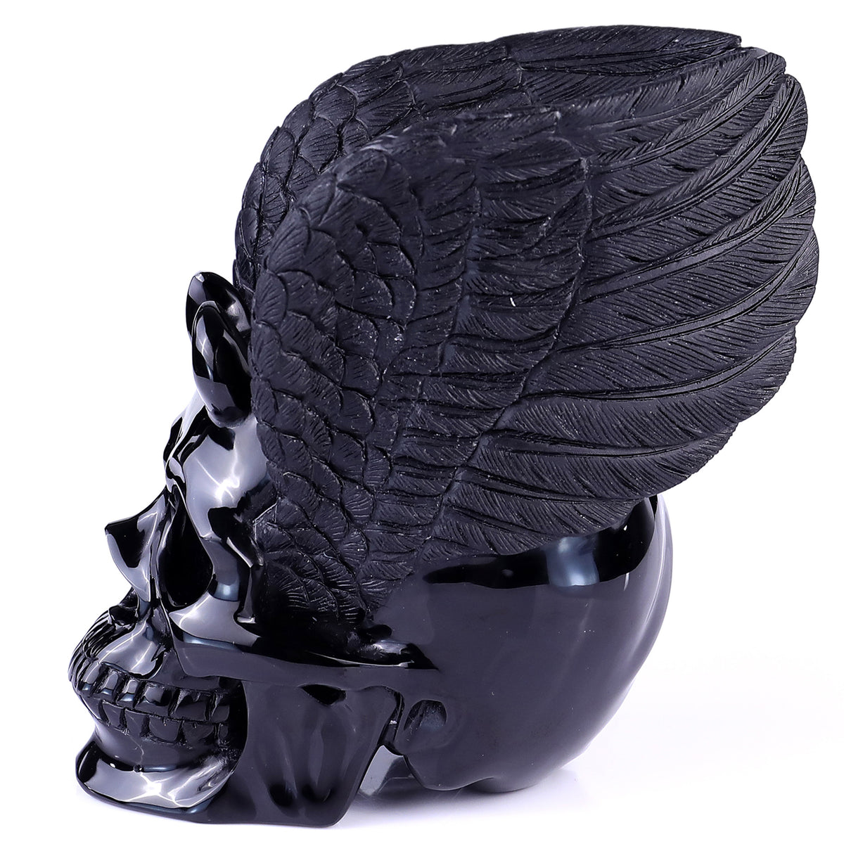 Left view of a one-of-a-kind Black Obsidian winged skull carving