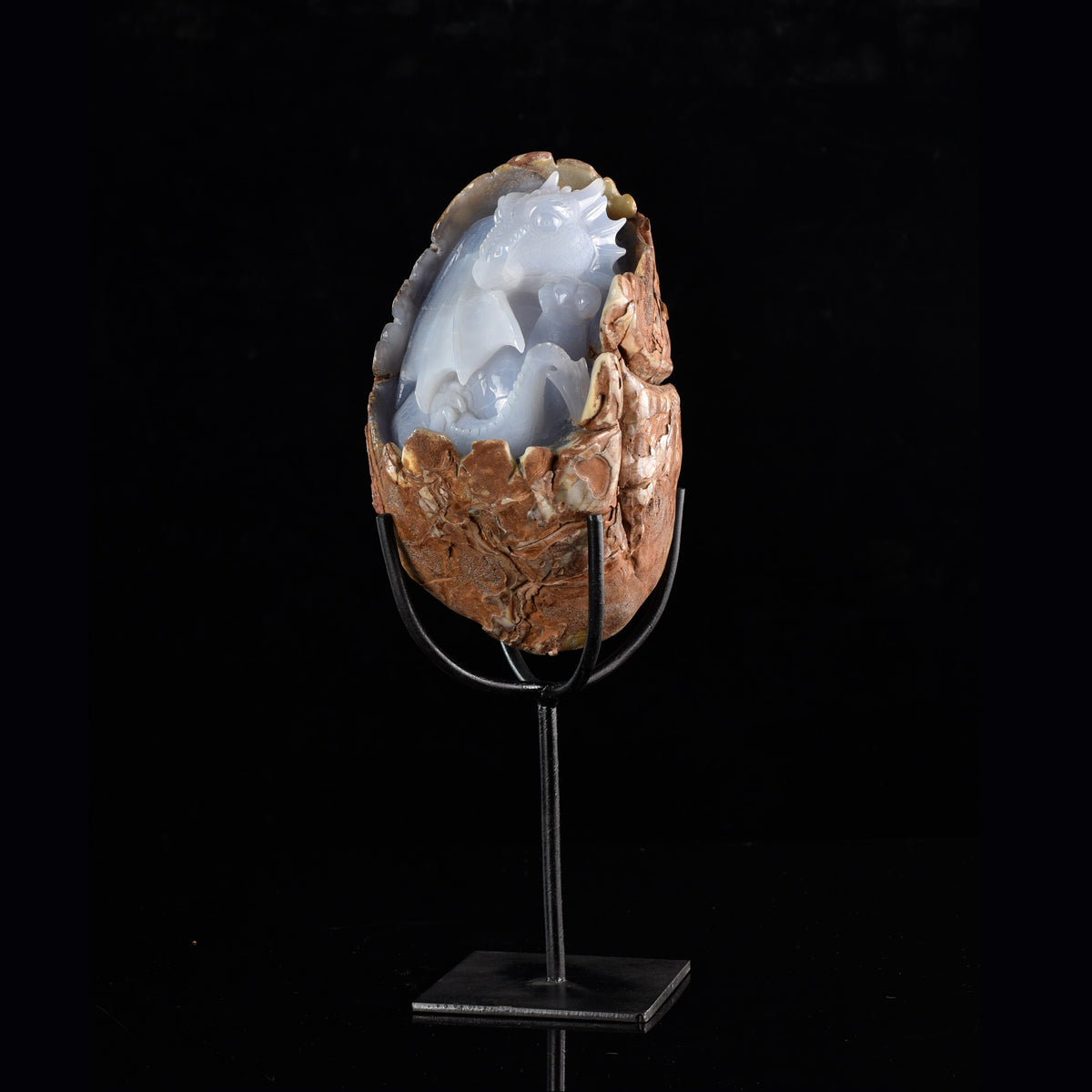 Right-front view of a one-of-a-kind Blue Chalcedony dragon with egg and hatching dragon sculpture