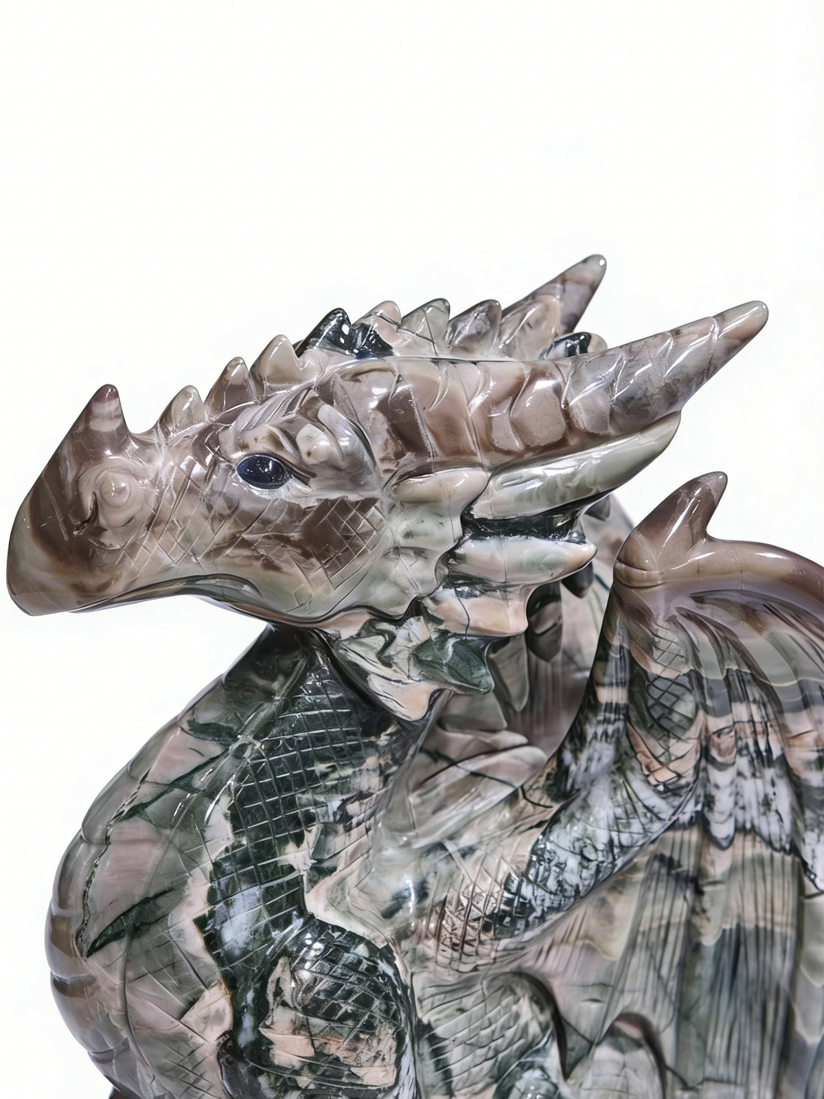 Additional view of a one-of-a-kind Nine Dragon Jade skull and winged dragon sculpture