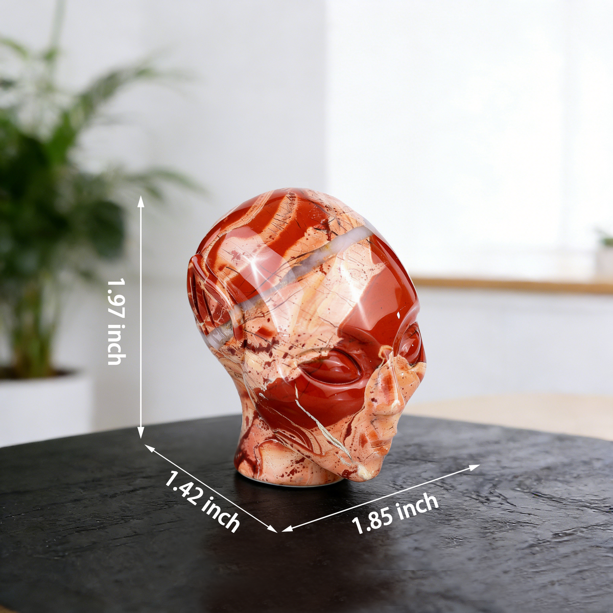 Additional view of a 2-inch Red Jasper alien skull carving
