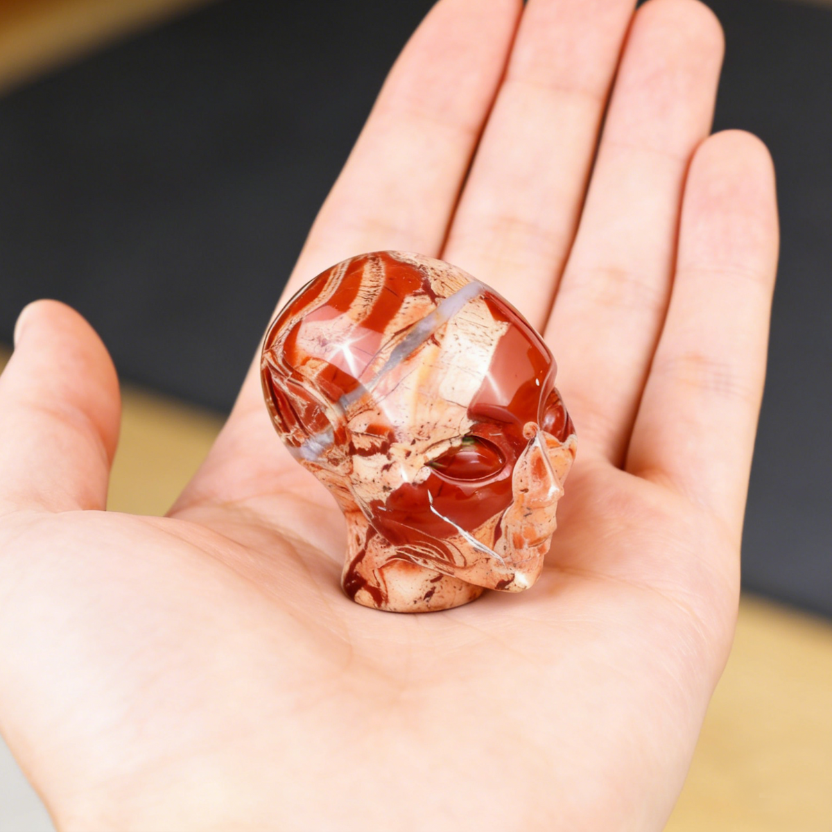 Additional view of a 2-inch Red Jasper alien skull carving