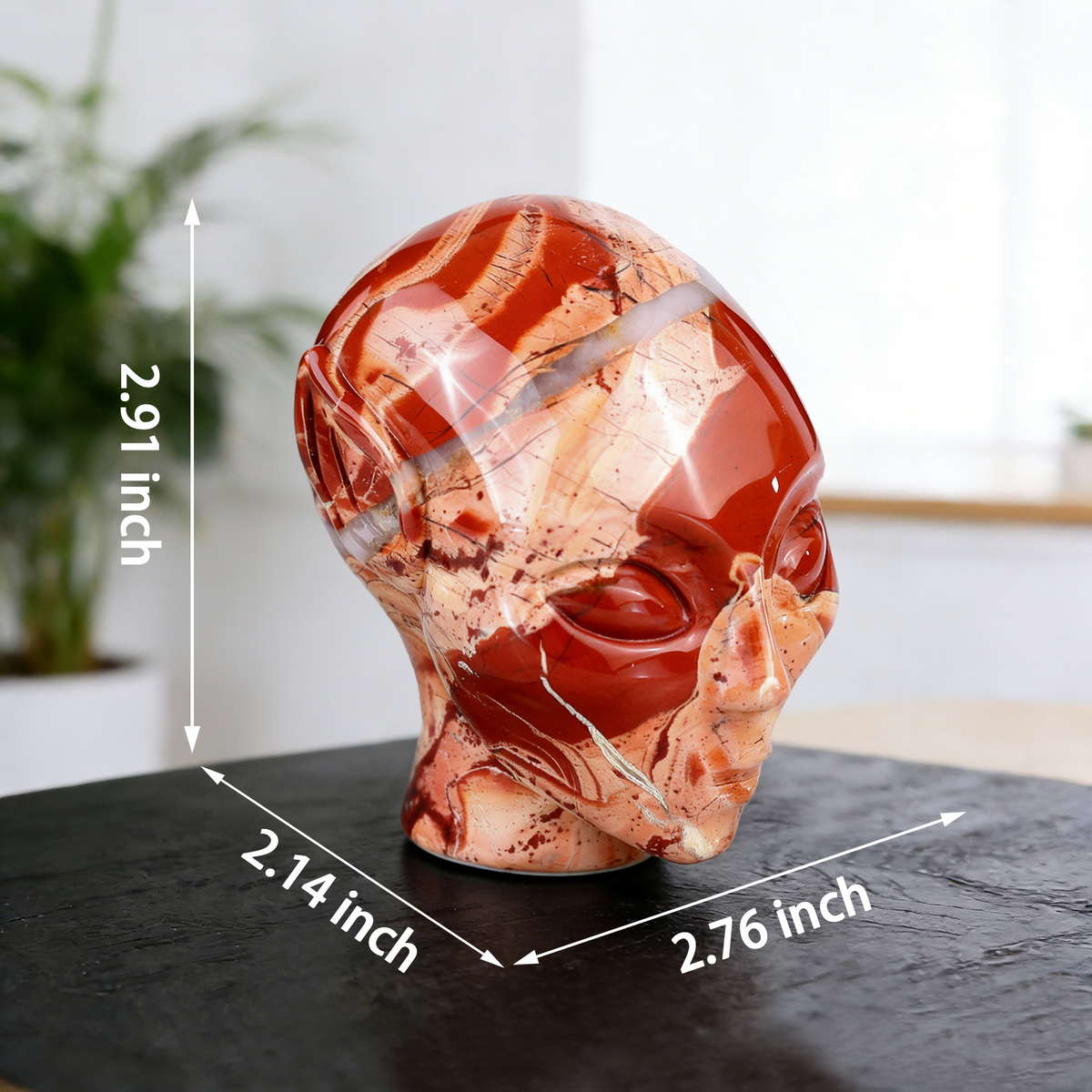 Additional view of a 3-inch Red Jasper alien skull carving