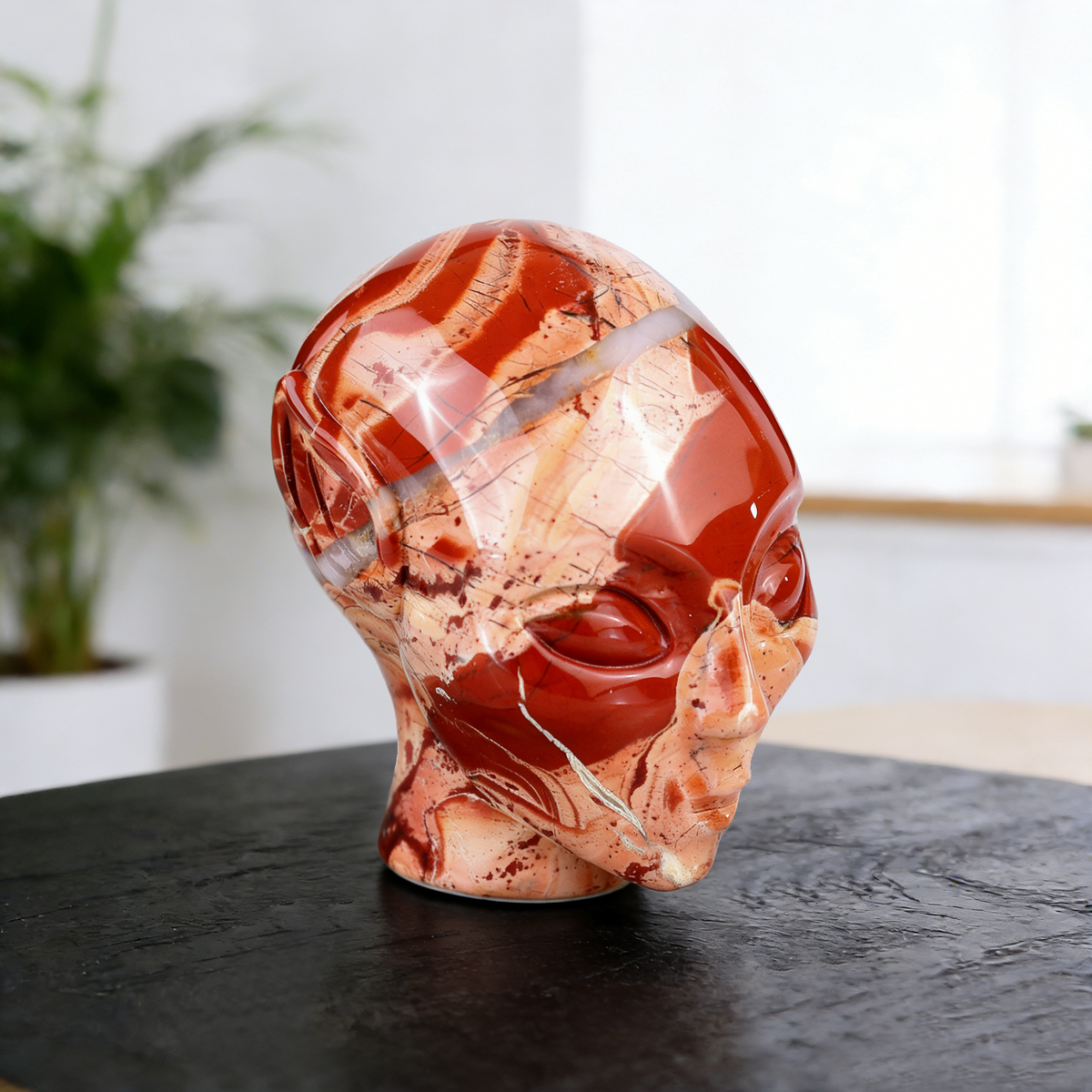 Additional view of a 3-inch Red Jasper alien skull carving