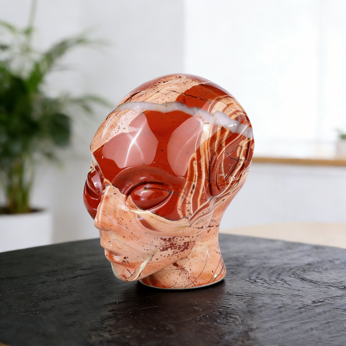 Additional view of a 3-inch Red Jasper alien skull carving