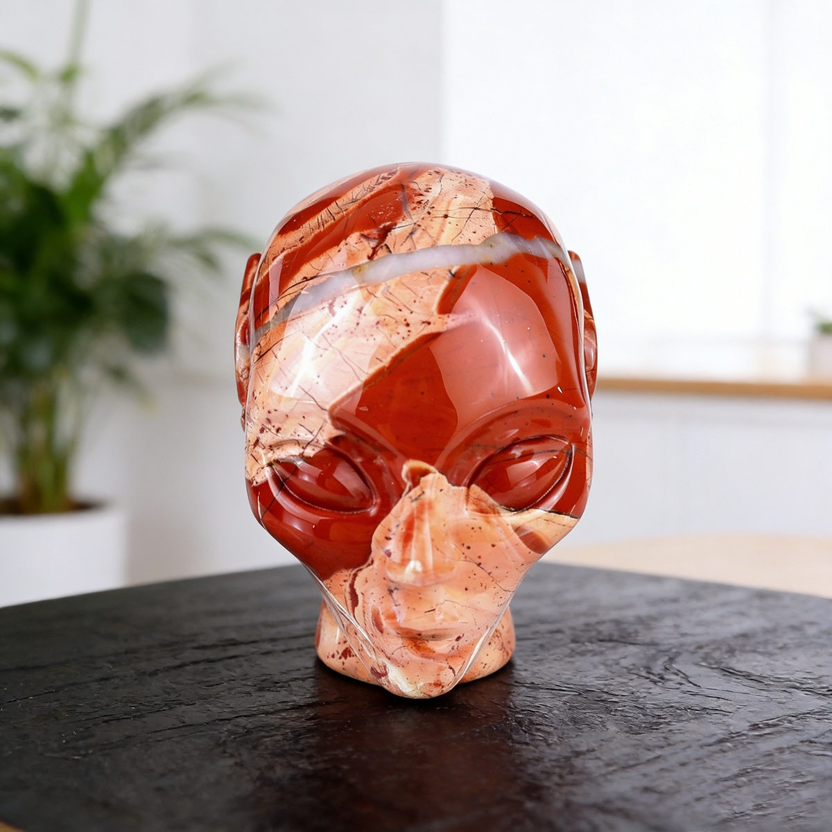 Additional view of a 3-inch Red Jasper alien skull carving
