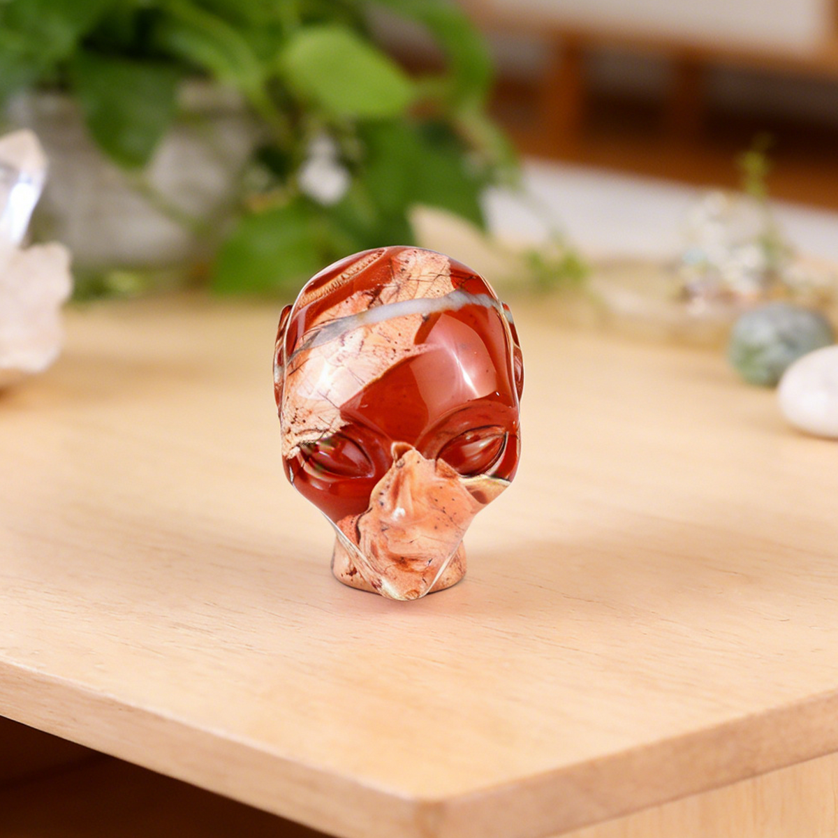 Additional view of a 3.8-inch Red Jasper alien skull carving