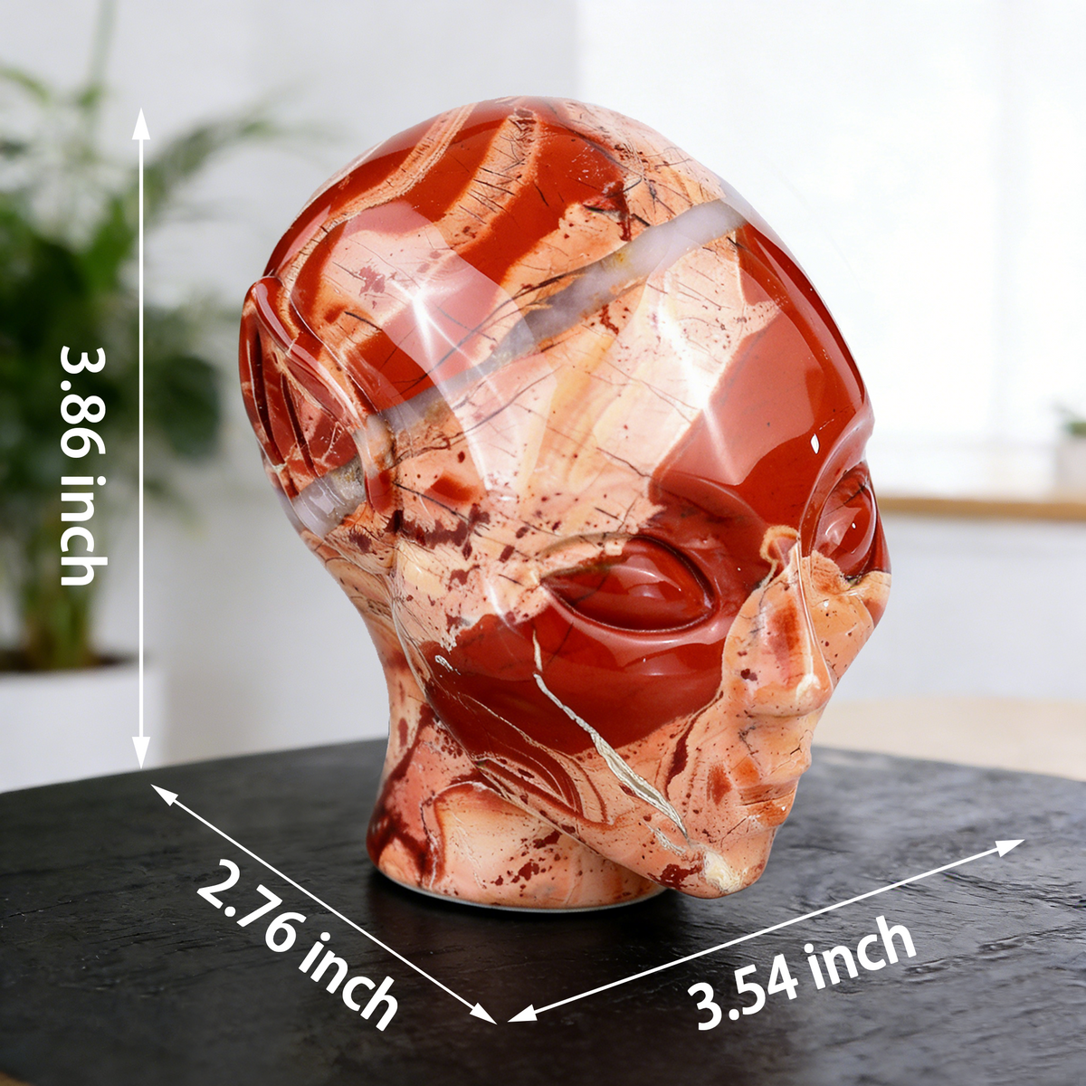 Additional view of a 3.8-inch Red Jasper alien skull carving