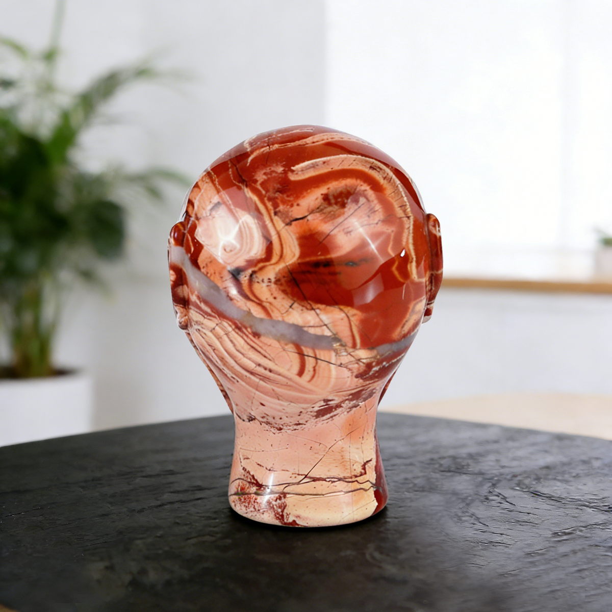 Additional view of a 3.8-inch Red Jasper alien skull carving