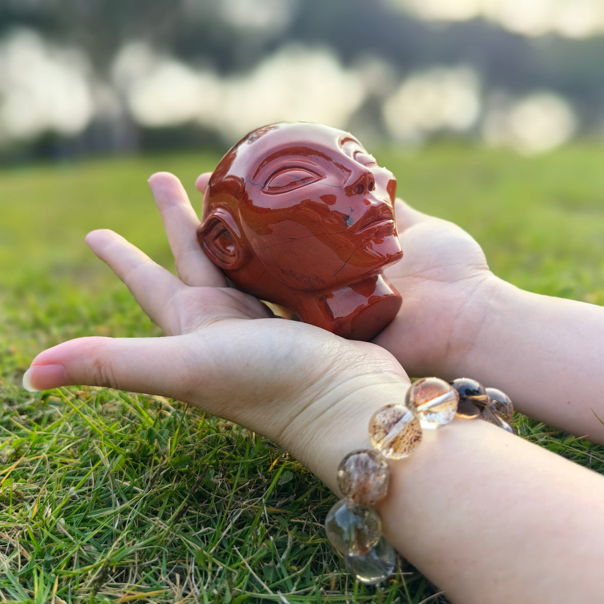 Additional view of a 3.8-inch Red Jasper alien skull carving