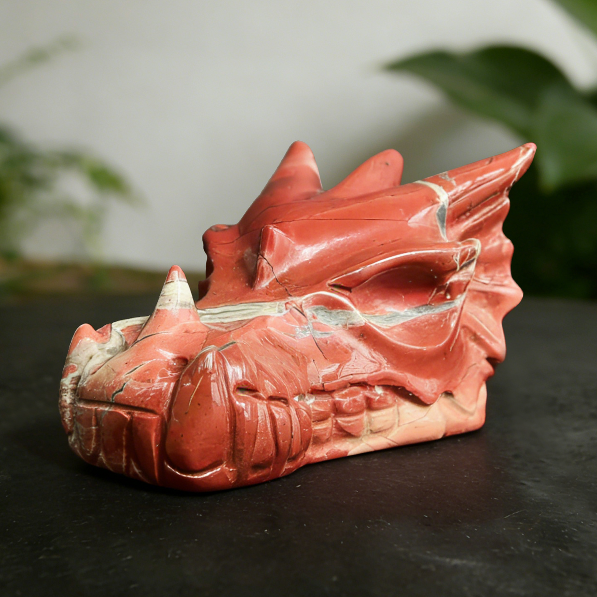 Additional view of a 2-inch Red Jasper dragon skull carving