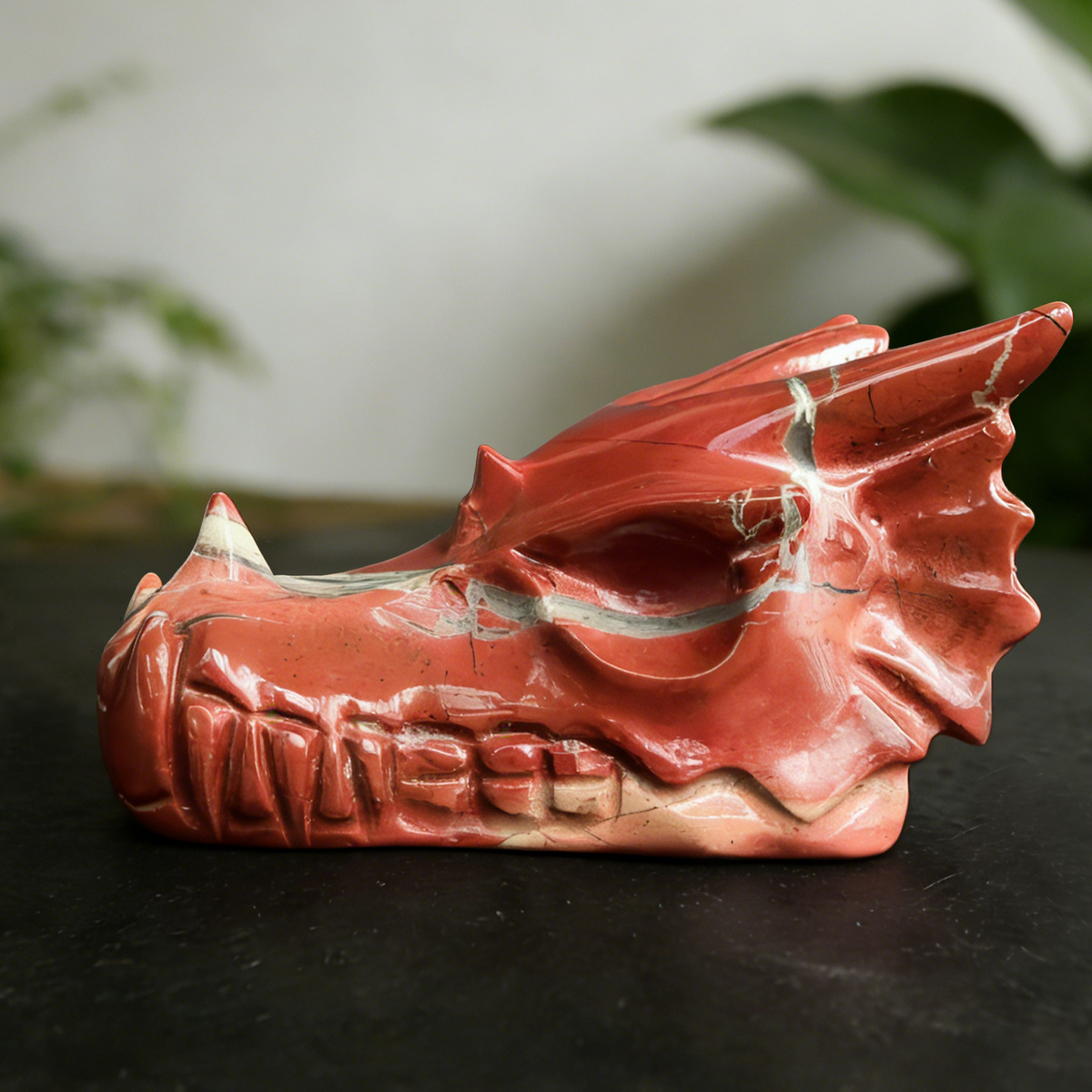 Additional view of a 2-inch Red Jasper dragon skull carving