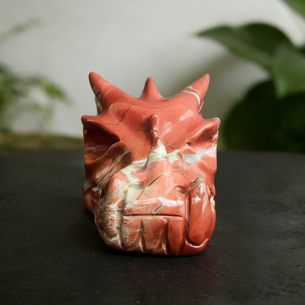 Additional view of a 2-inch Red Jasper dragon skull carving