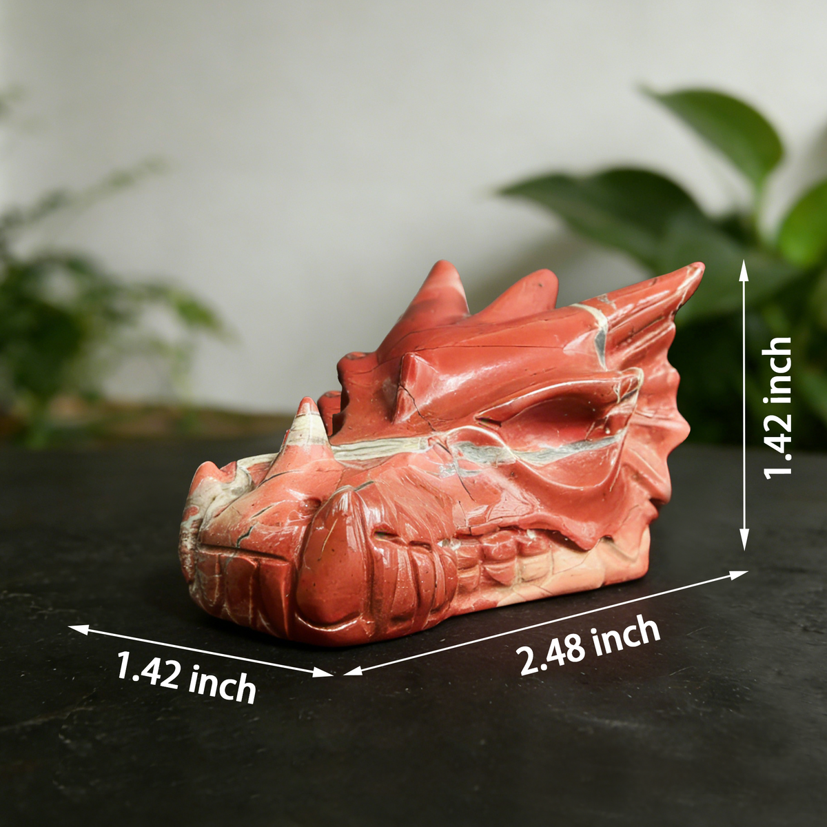 Additional view of a 2.5-inch Red Jasper dragon skull carving