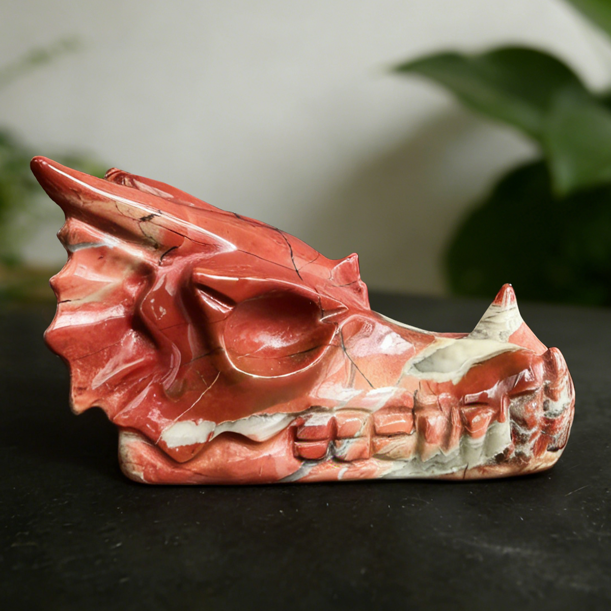 Additional view of a 3-inch Red Jasper dragon skull carving