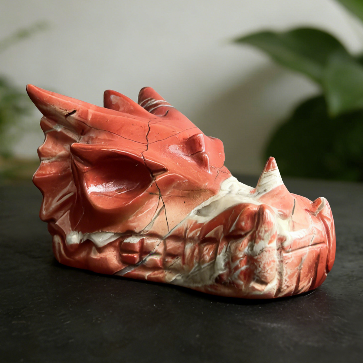 Additional view of a 3-inch Red Jasper dragon skull carving