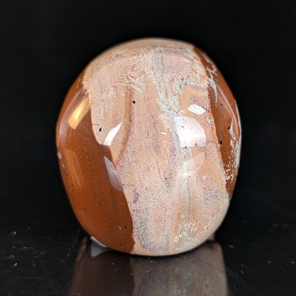 Back view of a 2-inch Red Jasper human skull carving