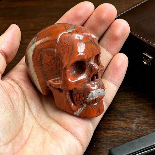 Main view of a 2-inch Red Jasper human skull carving