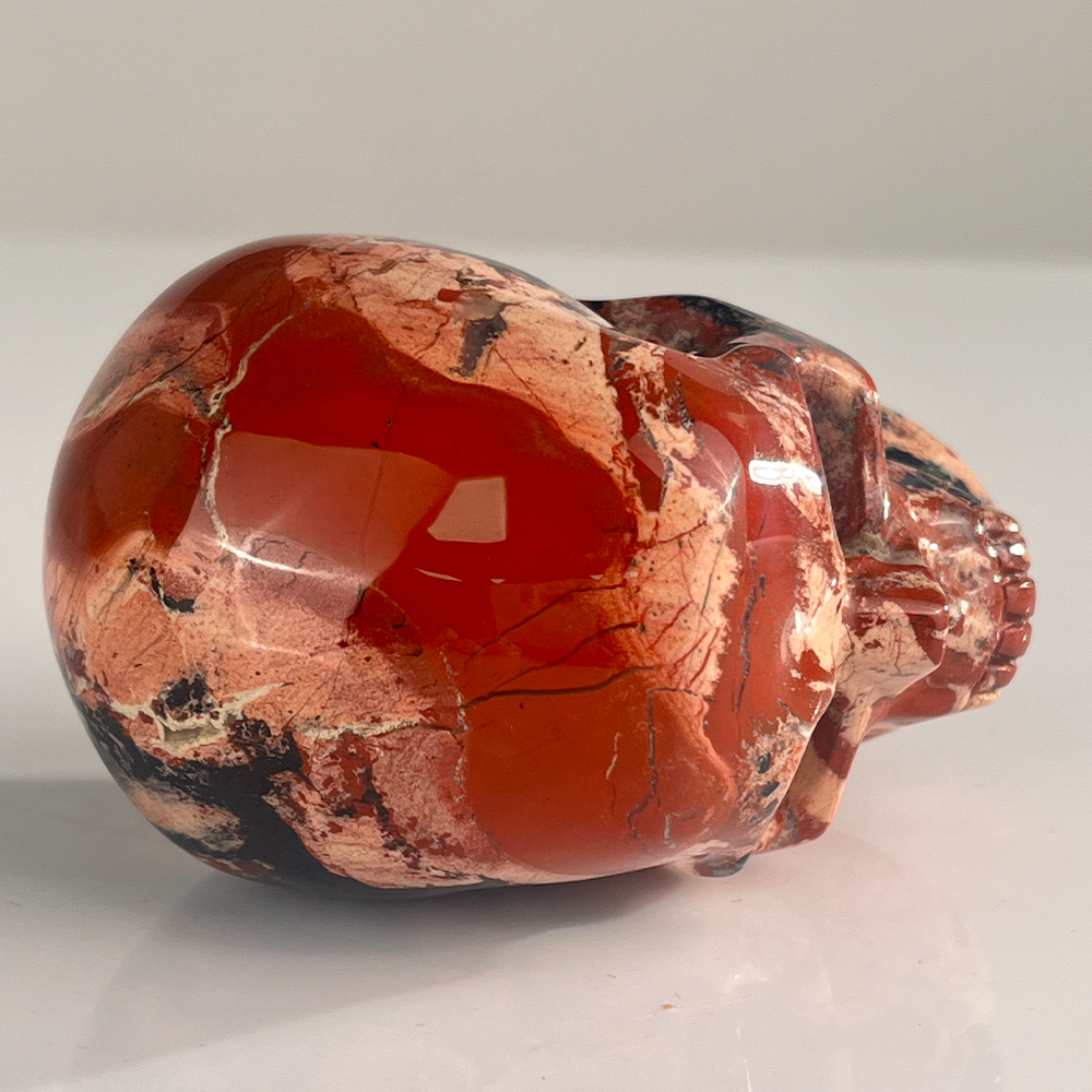 Top view of a 3-inch Red Jasper human skull carving