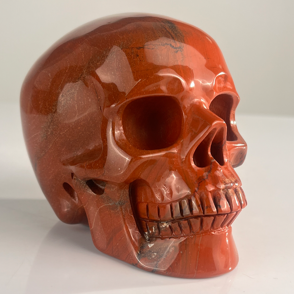 Right-front view of a 4.5-inch Red Jasper human skull carving