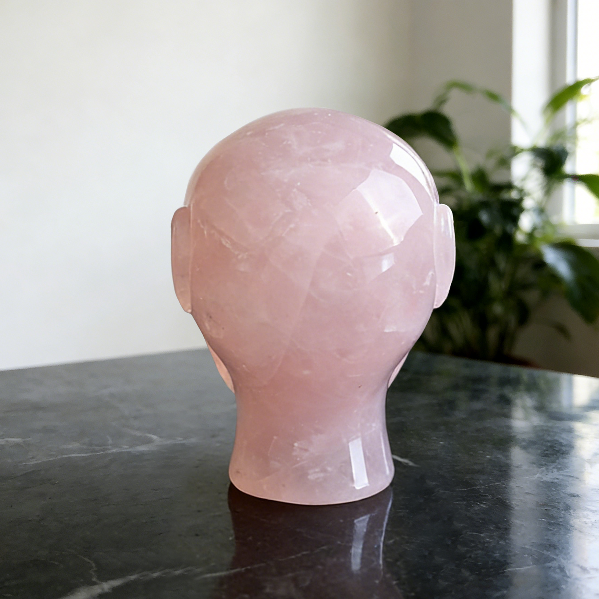 Additional view of a 3.8-inch Rose Quartz alien skull carving