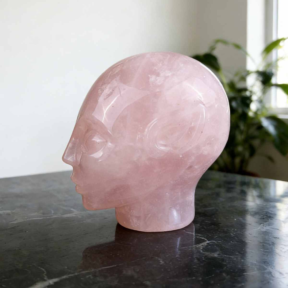 Additional view of a 3.8-inch Rose Quartz alien skull carving
