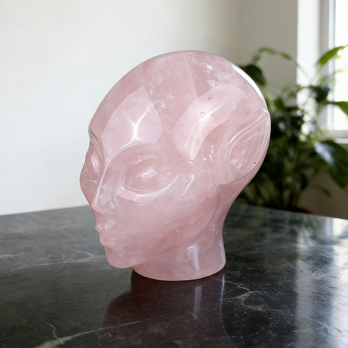 Additional view of a 3.8-inch Rose Quartz alien skull carving