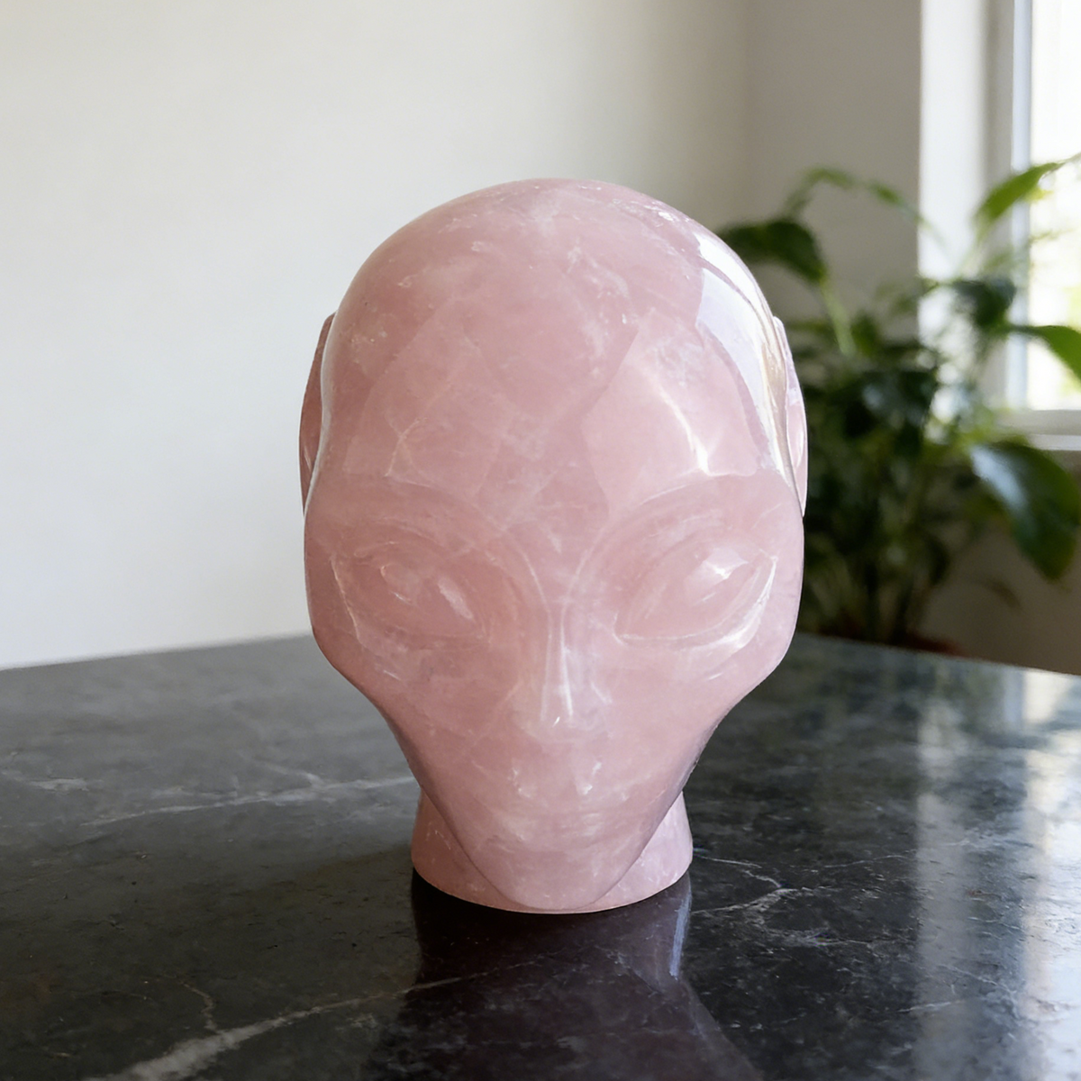 Additional view of a 3.8-inch Rose Quartz alien skull carving