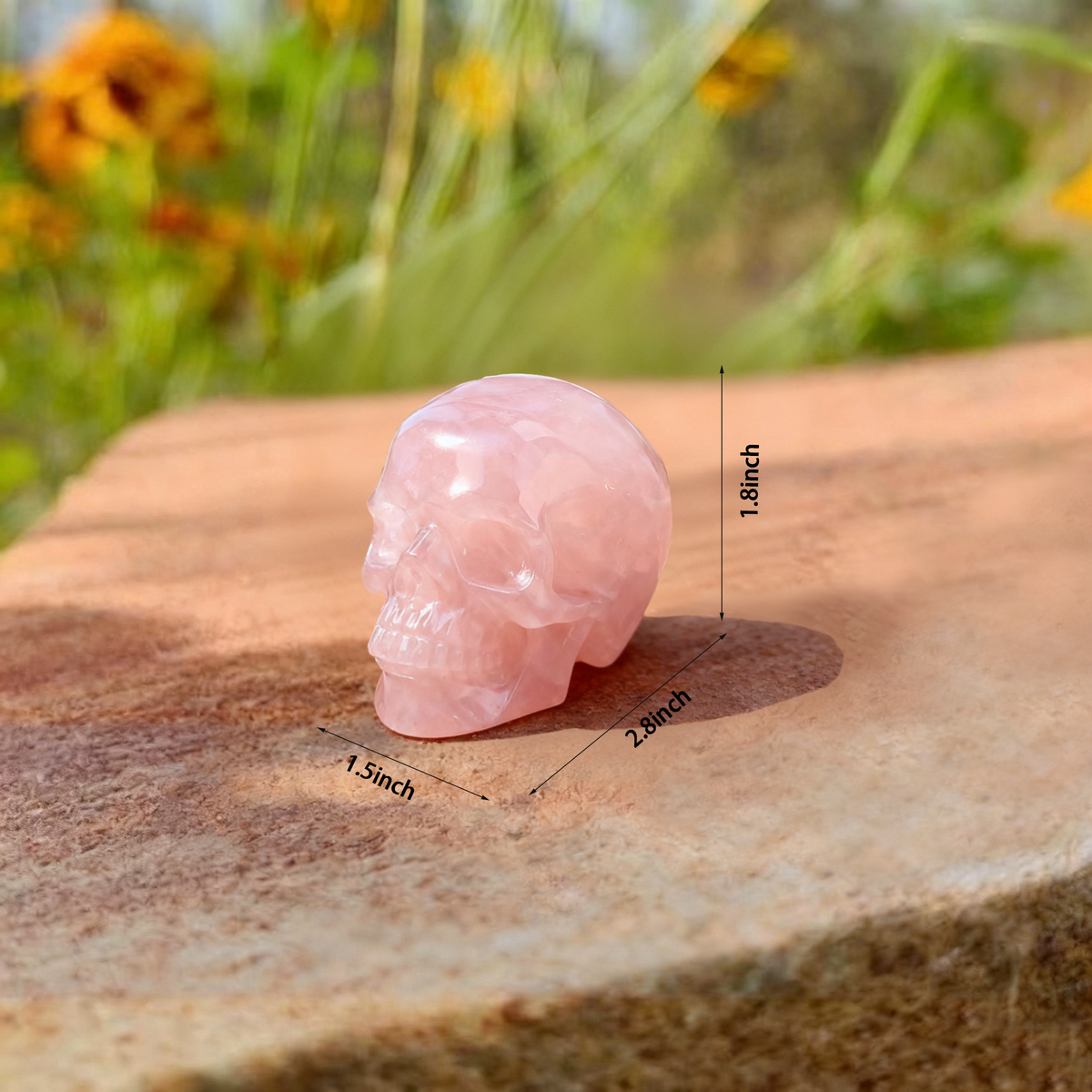 Additional view of a 2-inch Rose Quartz human skull carving