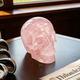 Additional view of a 3-inch Rose Quartz human skull carving