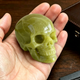 Additional view of a 2-inch Serpentine human skull carving