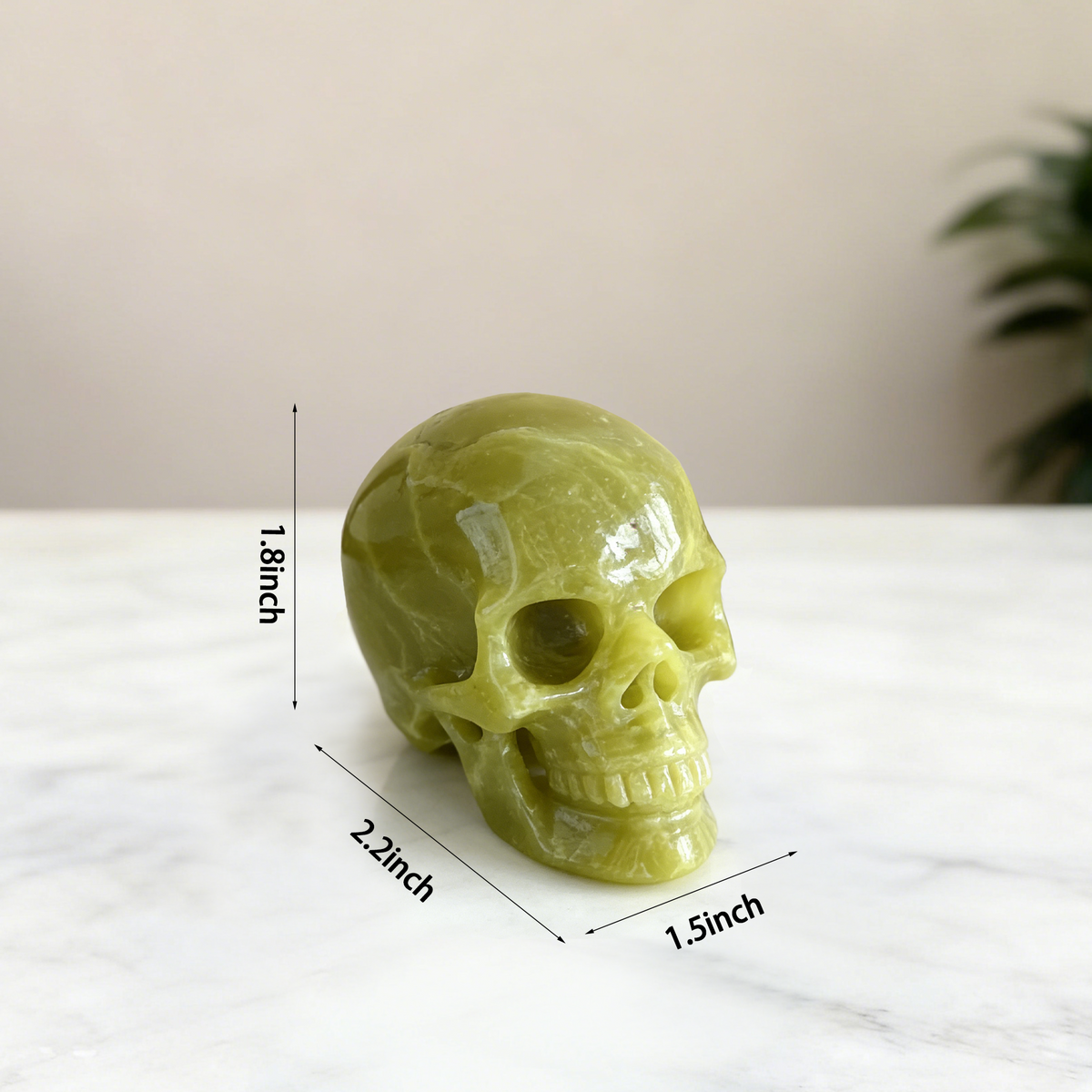 Additional view of a 2-inch Serpentine human skull carving