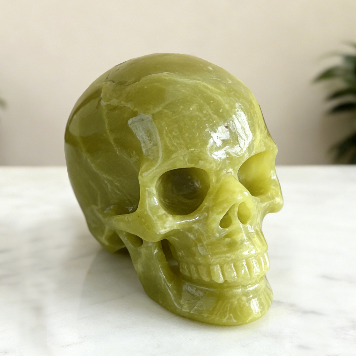 Additional view of a Serpentine human skull carving