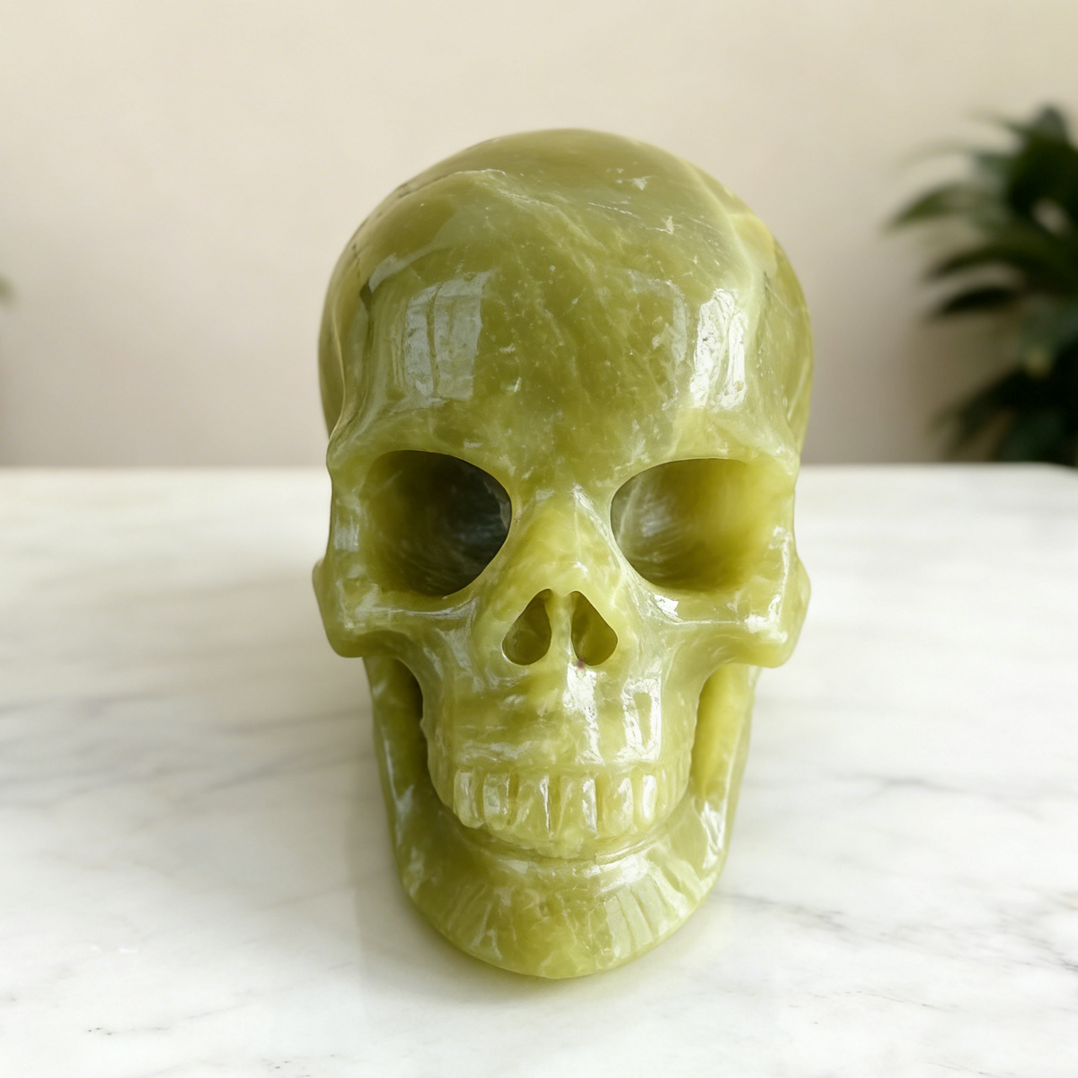 Additional view of a Serpentine human skull carving