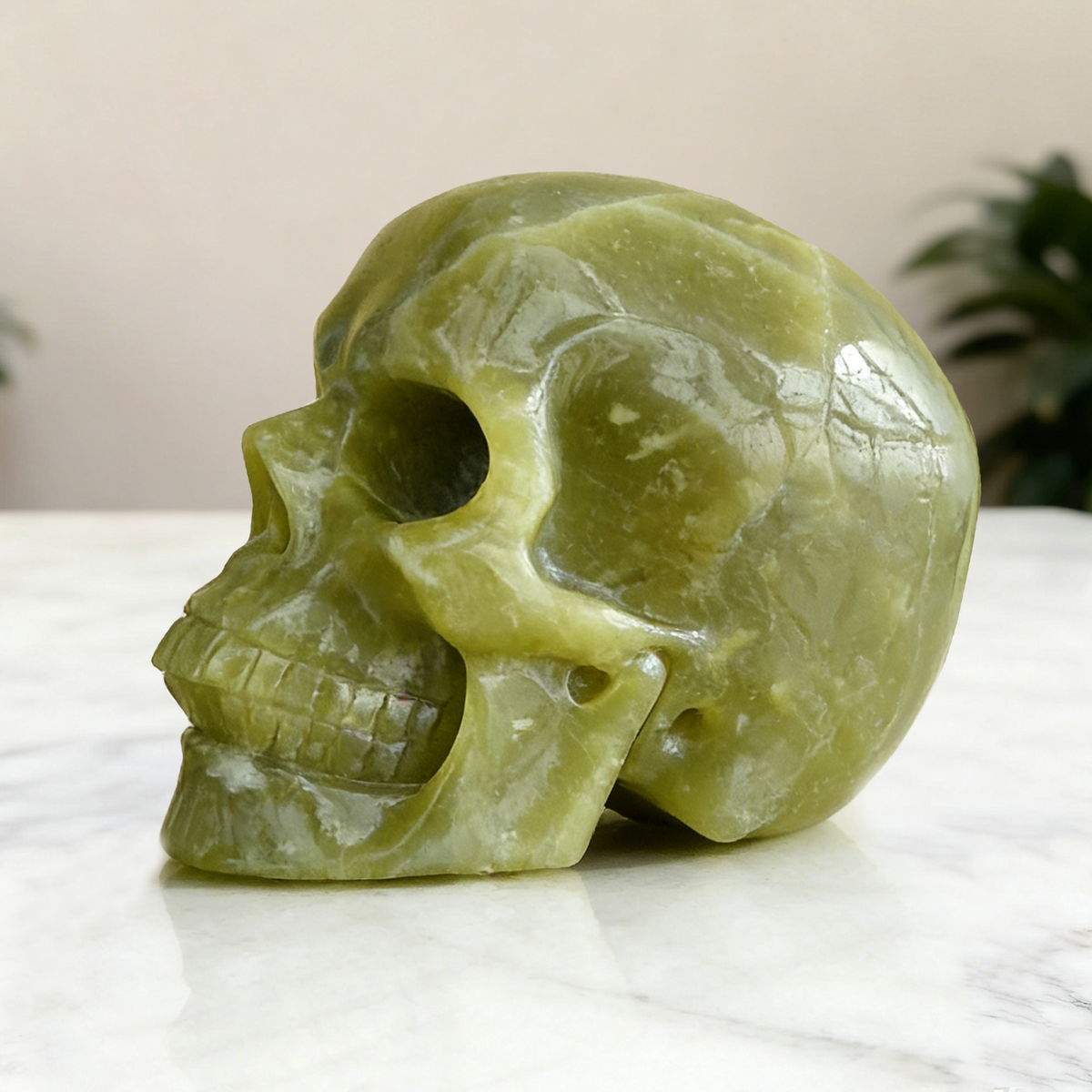 Additional view of a Serpentine human skull carving