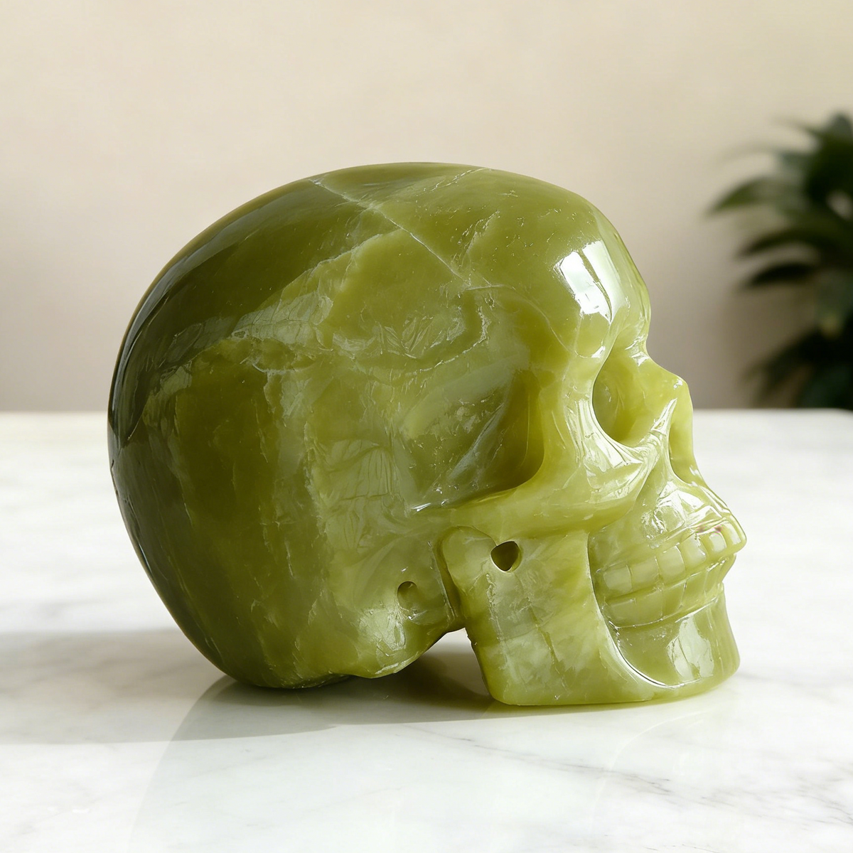 Additional view of a Serpentine human skull carving