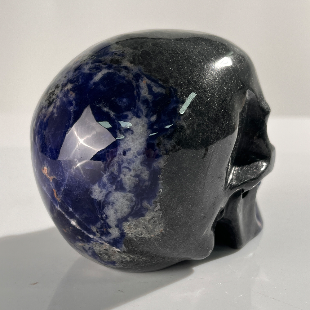 Additional view of a 4.5-inch Sodalite human skull carving