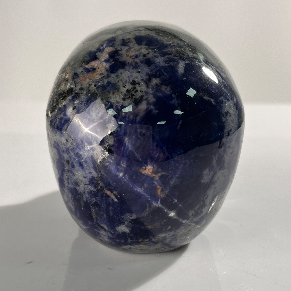 Back view of a 4.5-inch Sodalite human skull carving