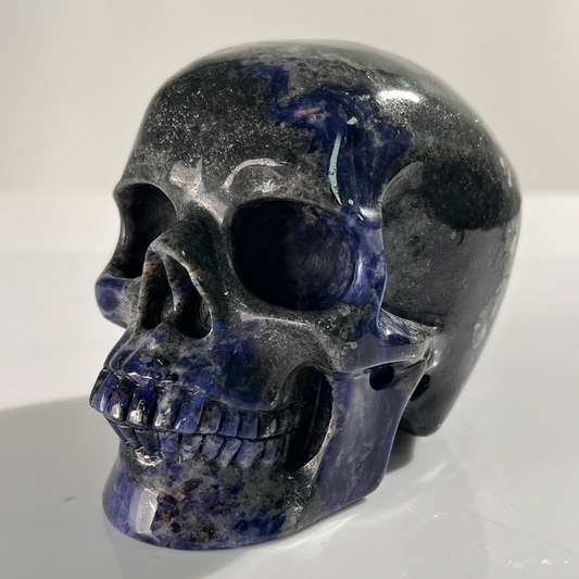 Left-front view of a 4.5-inch Sodalite human skull carving