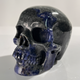 Left-front view of a 4.5-inch Sodalite human skull carving
