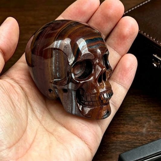 Main view of a 2-inch Tiger Iron human skull carving