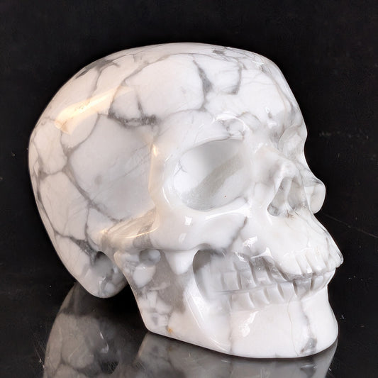Right-front view of a 2-inch White Howlite human skull carving