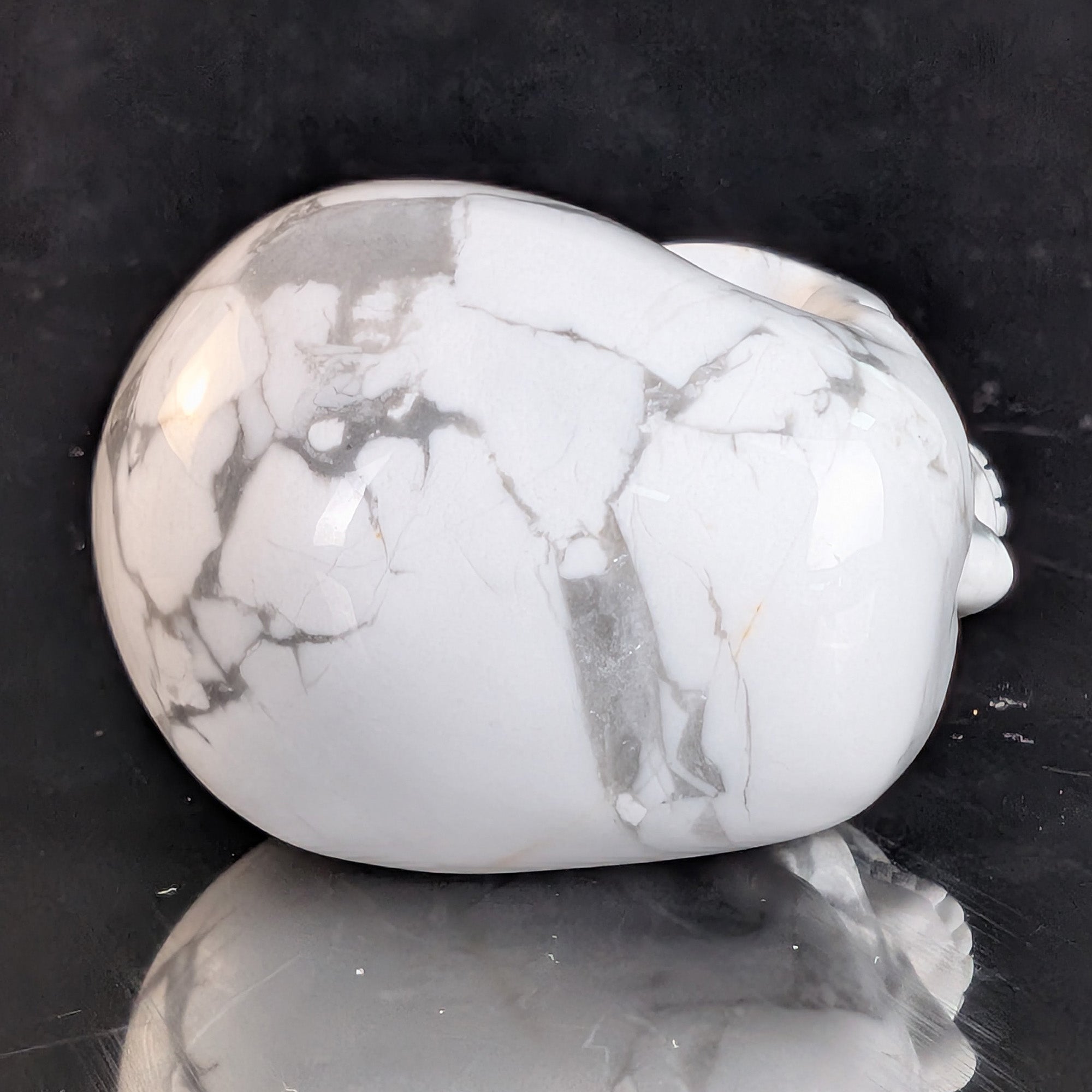 Top view of a 2-inch White Howlite human skull carving